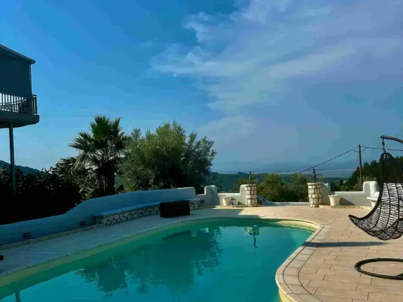 4-floor villa for sale in Katouna, 340 sq.m. on a 4,000 sq.m. plot with pool, sea view, independent studio, guesthouse & chapel. Just 950m from the sea.